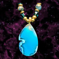 Heartfelt Creations Celestial Tear Pendant Necklace: vibrant blue agate teardrop pendant with gold-tone beads and teal crystal accents.