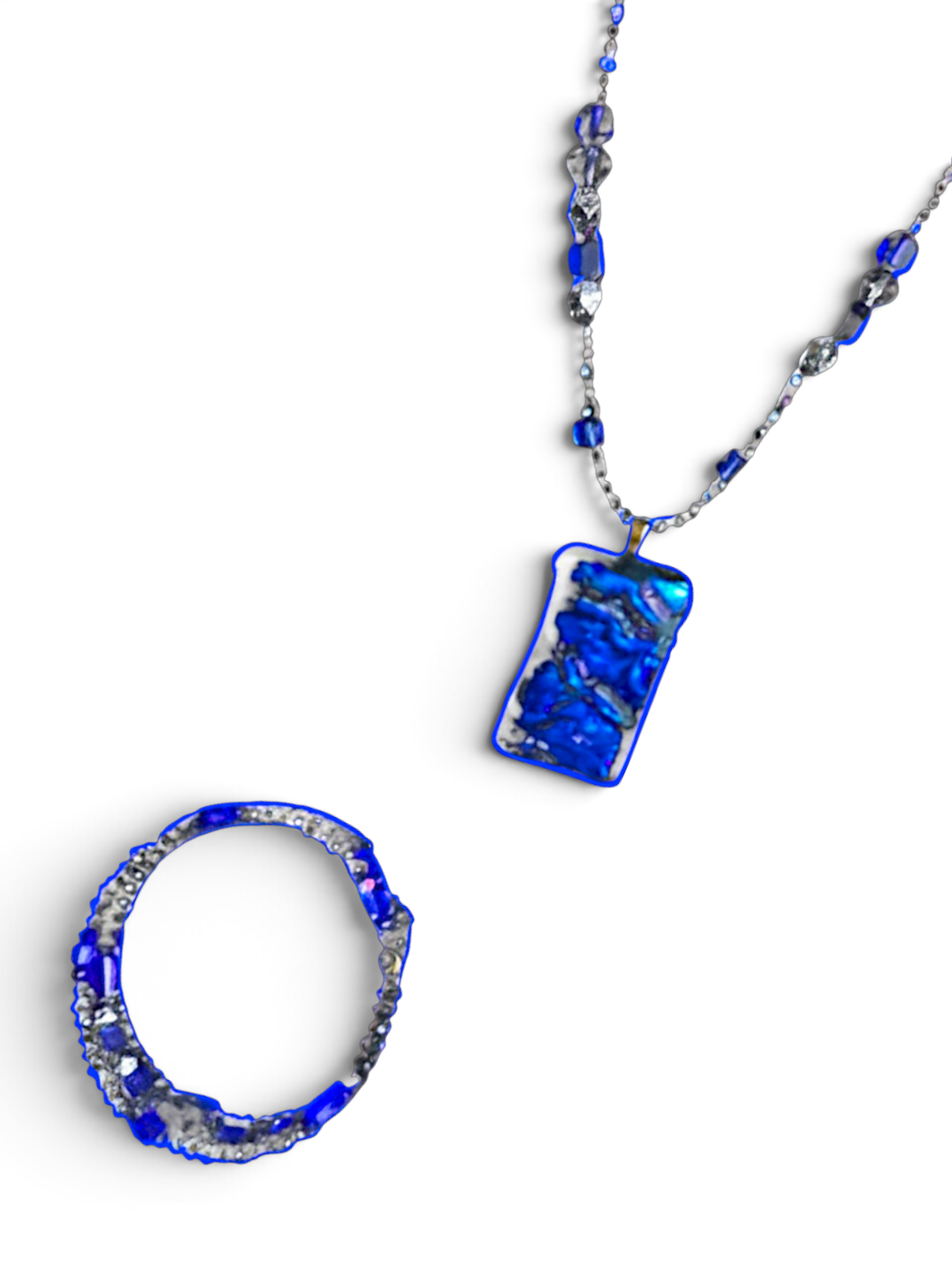 Heartfelt Creations artisan jewelry set featuring a deep blue iridescent pendant necklace and matching beaded bracelet.