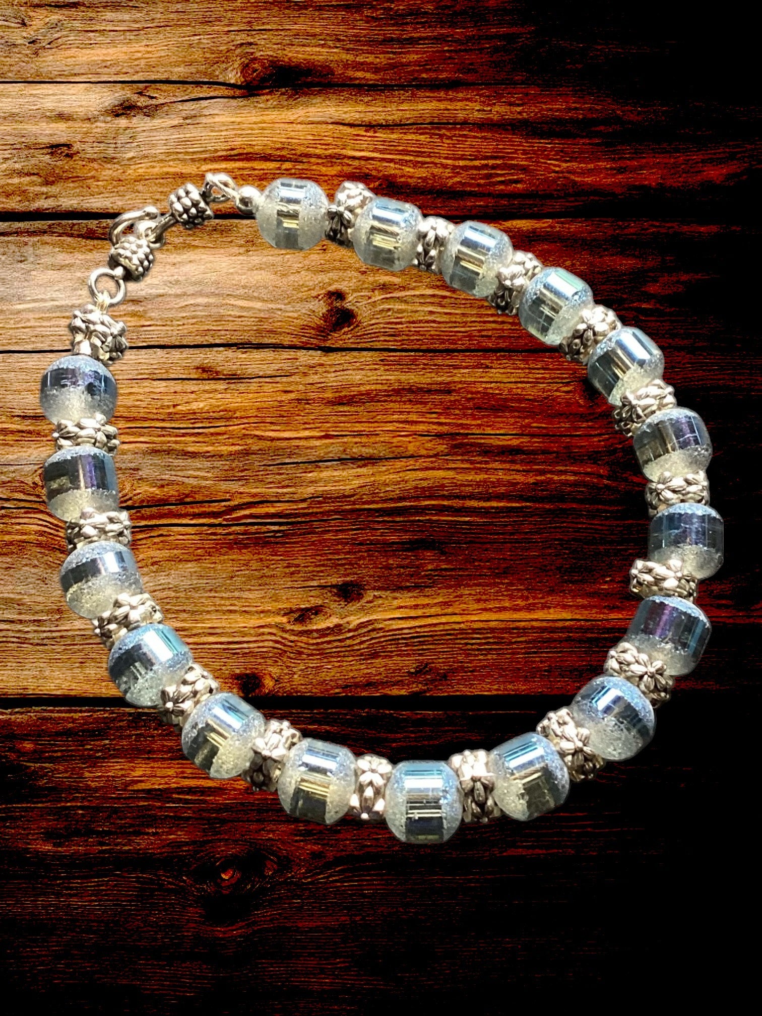 Heartfelt Creations blue faceted bead bracelet with silver-toned spacers. Shimmering translucent beads catch the light.
