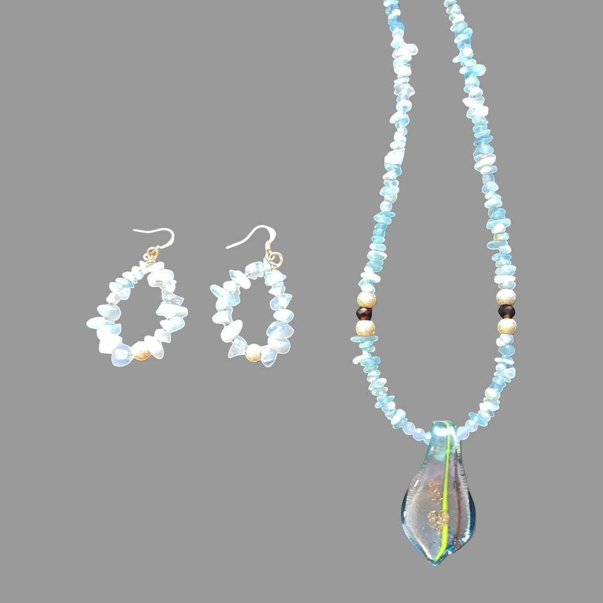Heartfelt Creations unique necklace and earring set is crafted with light blue Blue Chalcedony chips and an incredible handmade dichroic glass pendant. This is a STUNNER!!!!