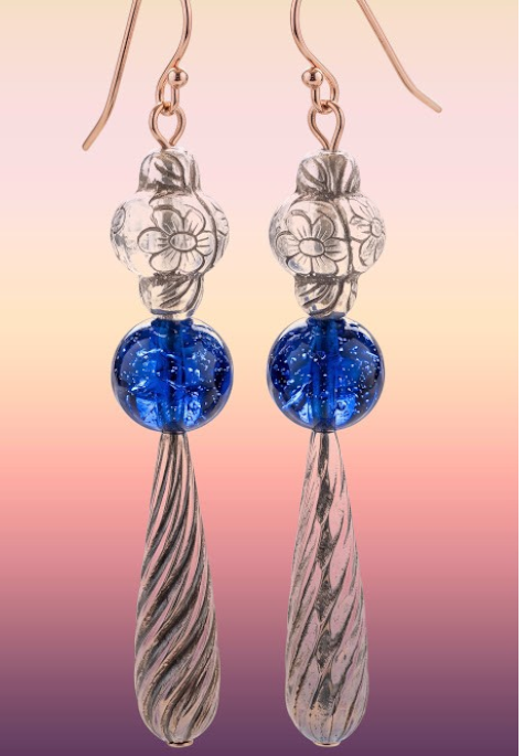 Heartfelt Creations artisan drop earrings featuring silver floral beads, cobalt blue glass spheres, and twisted pendants.