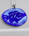Heartfelt Creations handcrafted deep blue fused glass fish pendant necklace with textured details on a silver chain.