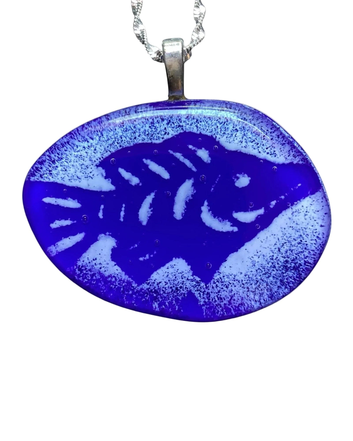 Heartfelt Creations handcrafted enameled deep blue fused glass fish pendant necklace with textured details on a silver chain.