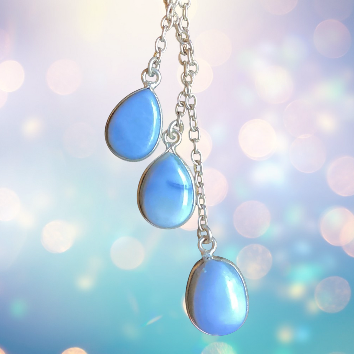 Heartfelt Creations sterling silver Y-drop necklace with three bezel-set blue opal teardrop charms on a fine chain.