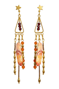 A pair of bohemian-style gold dangle earrings featuring star-shaped studs, triangular chains, dark red beads, orange and brown beads, and a large central iridescent shell-like charm with orange and cream marbling.