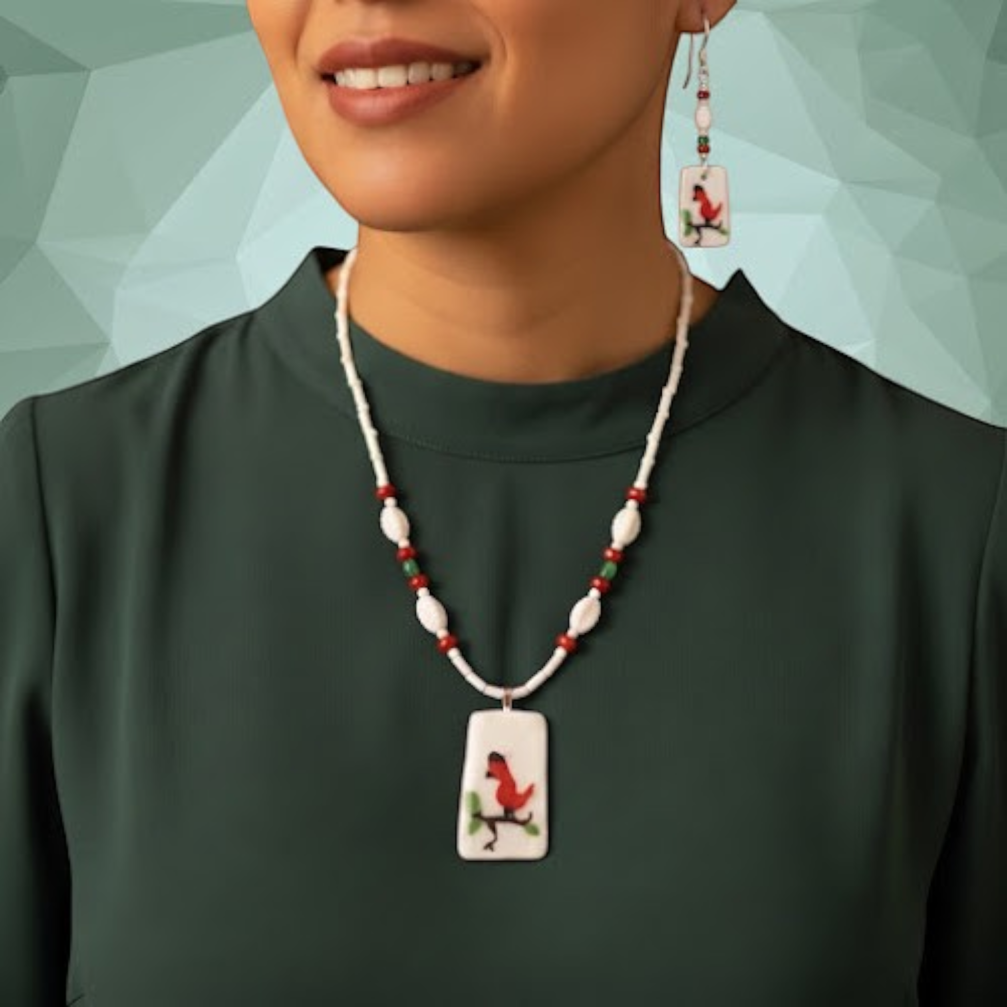 Heartfelt Creations cardinal bird beaded necklace and earring set in red, white, and green on a model