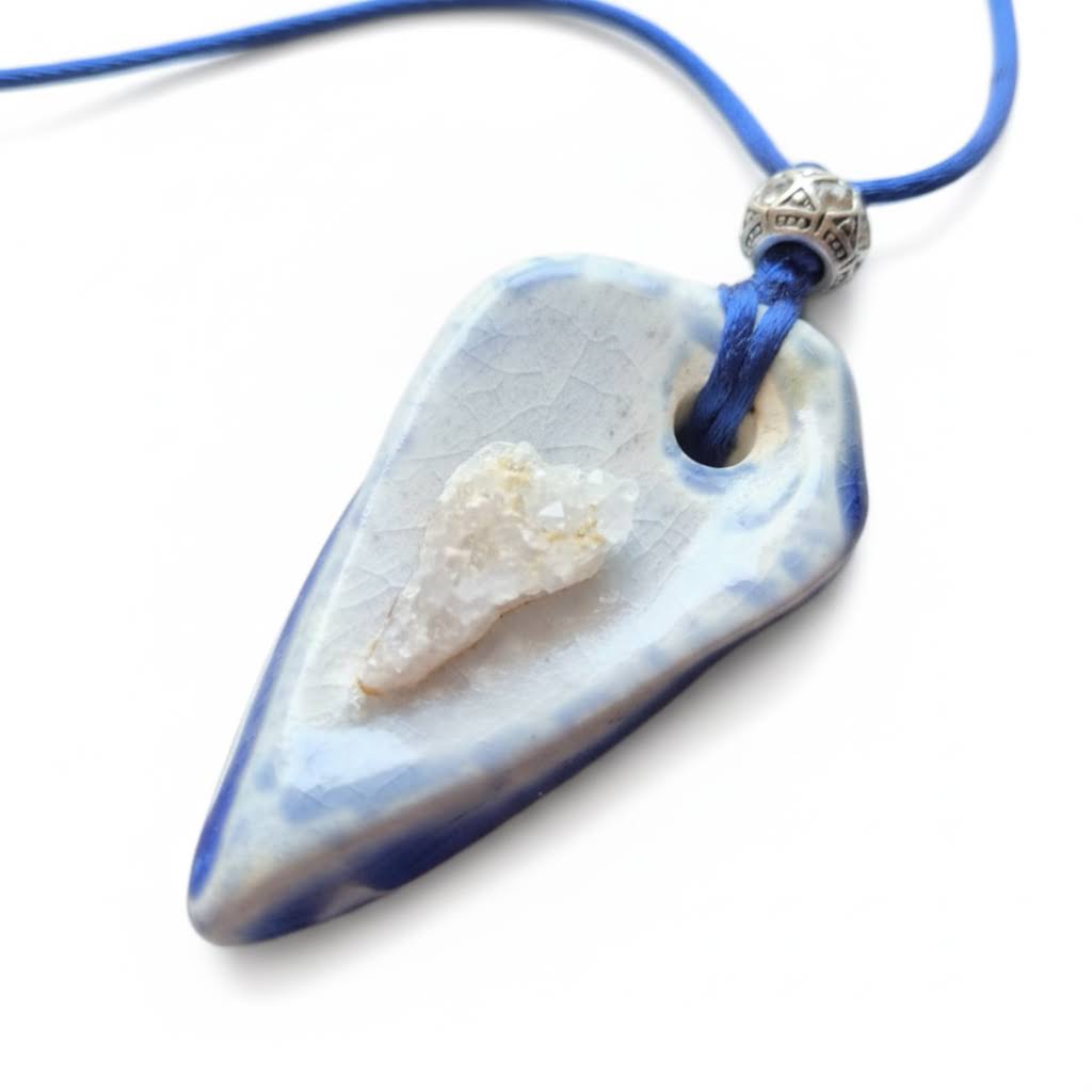 Heartfelt Creations artisan ceramic pendant necklace with blue and white crackle glaze, raw crystal, and silver bead.
