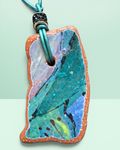Heartfelt Creations artisan ceramic pendant necklace with crackled teal, blue, and pink glaze on a teal leather cord.