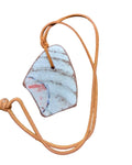 Heartfelt Creations artisan ceramic pendant necklace with a rustic textured finish on a warm-toned leather cord