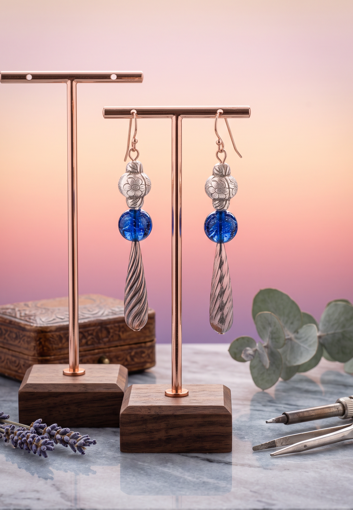 Heartfelt Creations artisan drop earrings with silver floral beads, cobalt blue glass spheres, and twisted pendants.