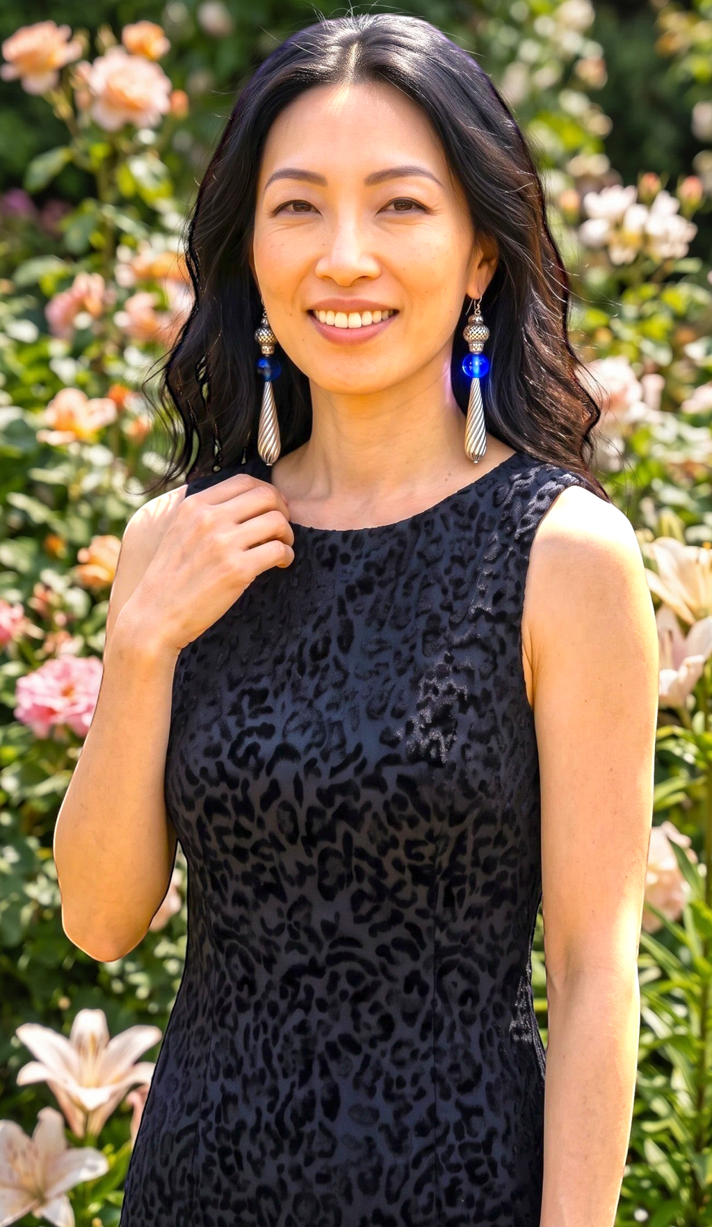 Heartfelt Creations artisan drop earrings featuring cobalt blue glass spheres and silver twisted teardrop pendants.
