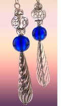Heartfelt Creations artisan drop earrings with silver floral beads, cobalt blue glass spheres, and twisted pendants.