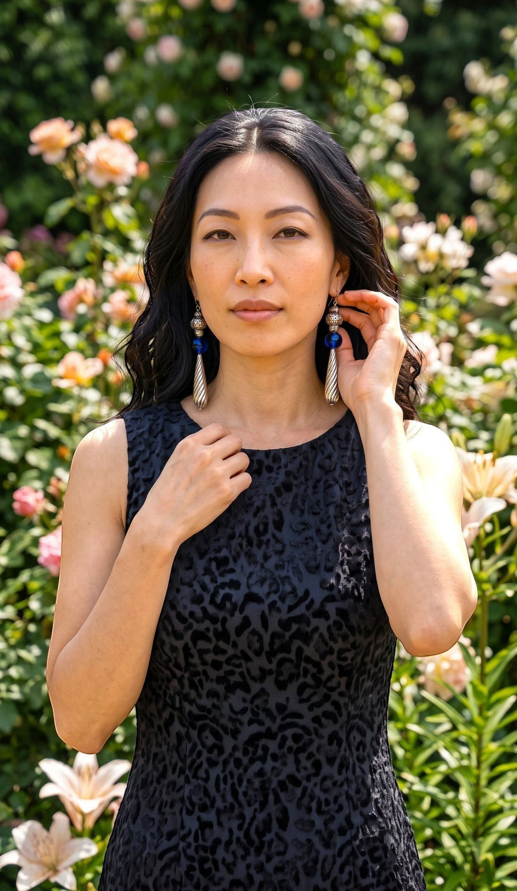 Heartfelt Creations artisan drop earrings featuring silver floral beads, cobalt blue glass spheres, and twisted pendants.