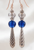 Heartfelt Creations artisan drop earrings featuring silver floral beads, cobalt blue glass spheres, and twisted pendants