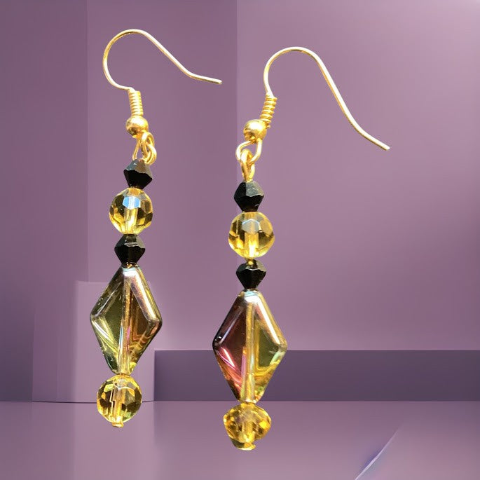 Heartfelt Creations artisan dangle earrings featuring iridescent dichroic glass beads with black and yellow accents