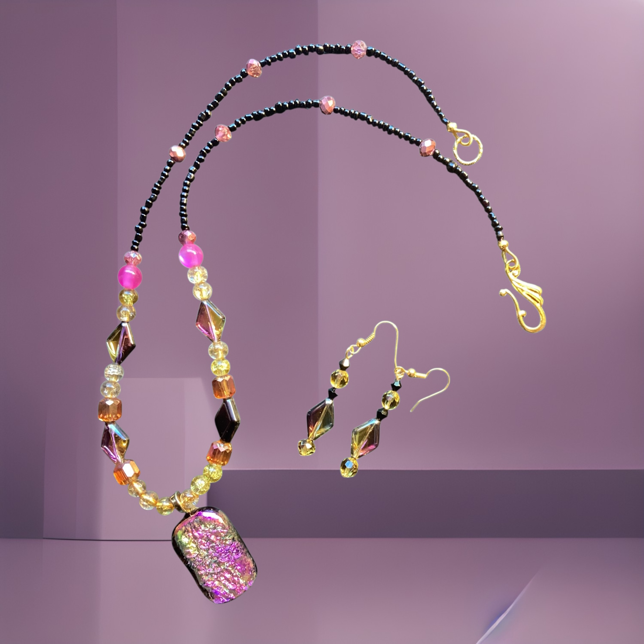 Heartfelt Creations artisan necklace and earring set with a dichroic glass pendant and multi-colored beaded strands.