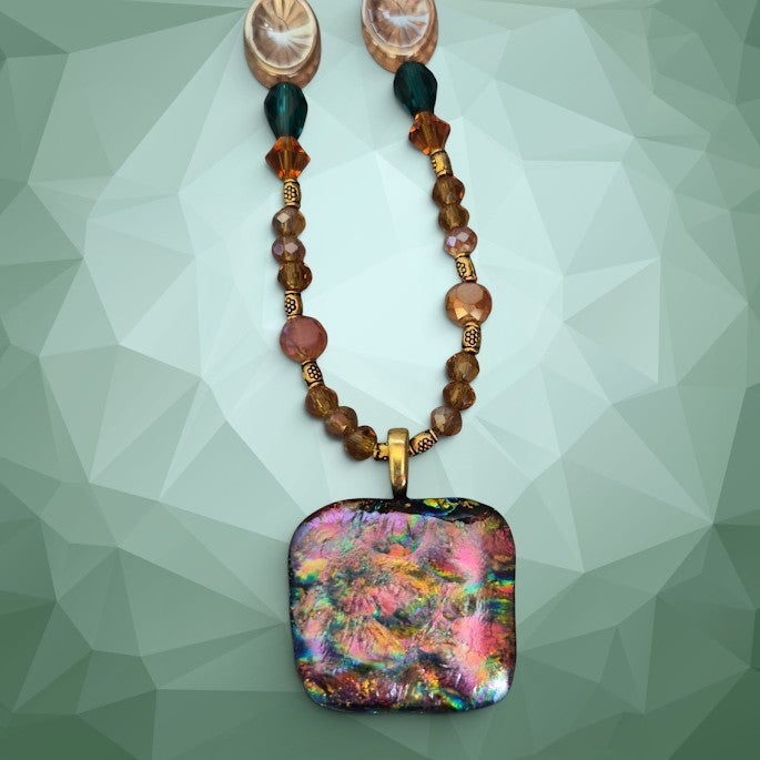 Heartfelt Creations artisan dichroic glass square pendant necklace with amber crystals and teal bead accents.