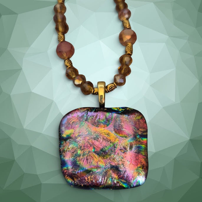 Heartfelt Creations artisan dichroic glass square pendant necklace with amber crystals and metallic spacers.