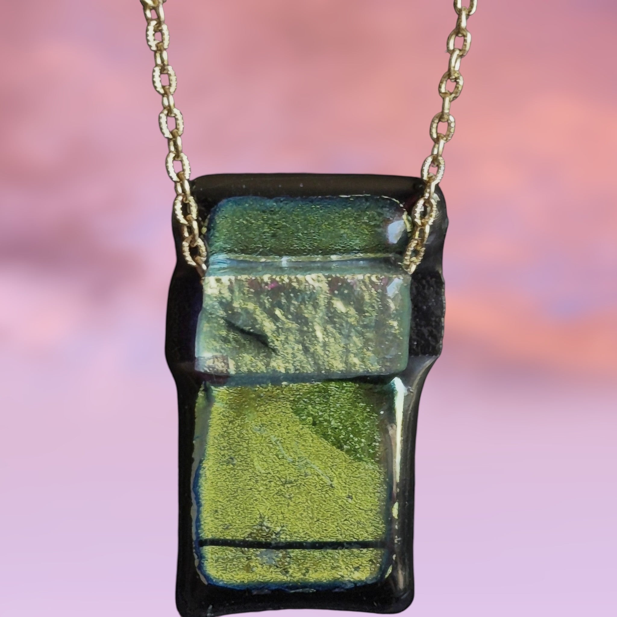 Heartfelt Creations handcrafted dichroic glass pendant necklace in green and black on a gold-tone chain.
