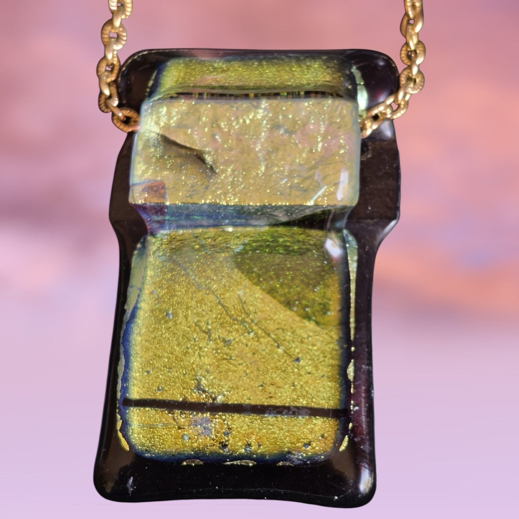 Heartfelt Creations handcrafted dichroic glass pendant necklace in shimmering green and black on a gold-tone chain.
