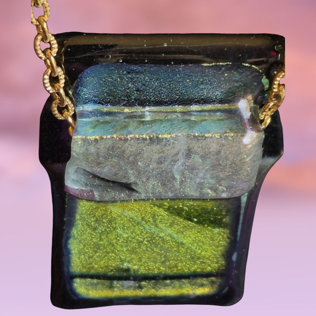 Heartfelt Creations handcrafted dichroic glass pendant necklace in green and black on a gold-tone chain.