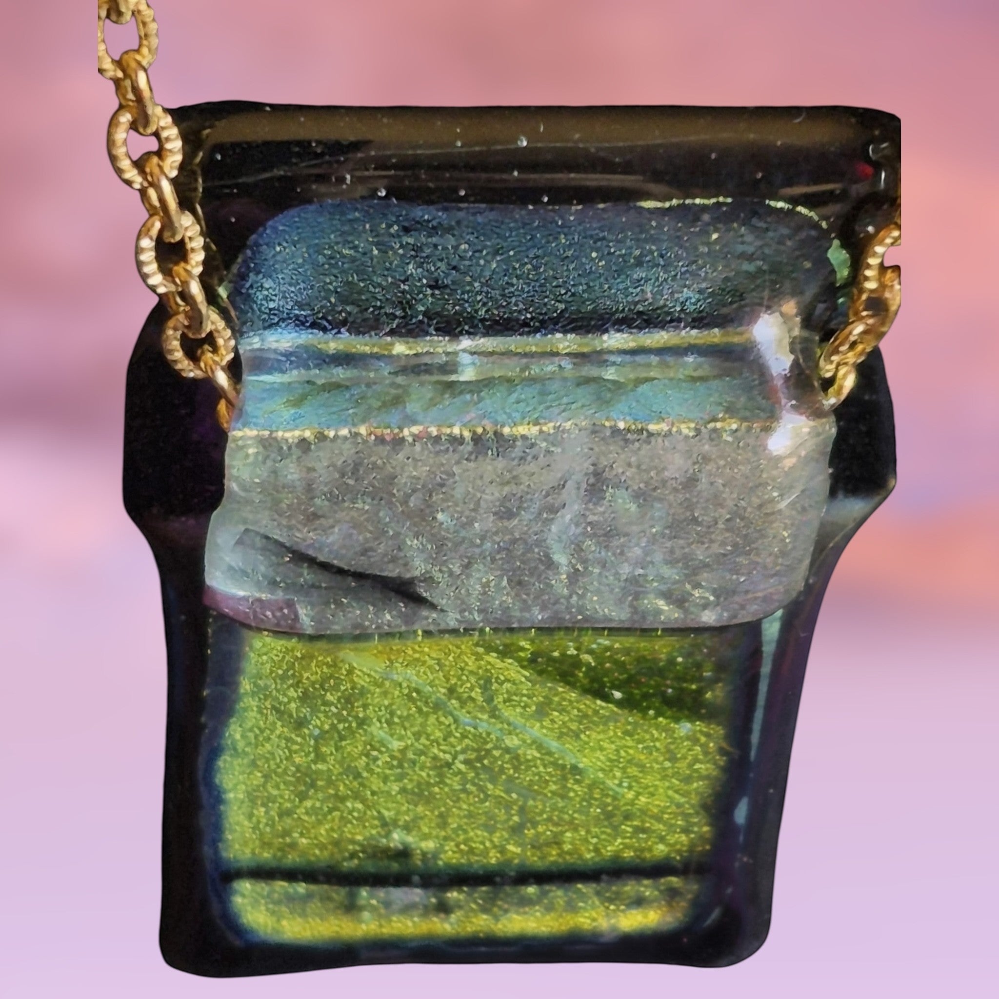 Heartfelt Creations handcrafted dichroic glass pendant necklace in green and black on a gold-tone chain.
