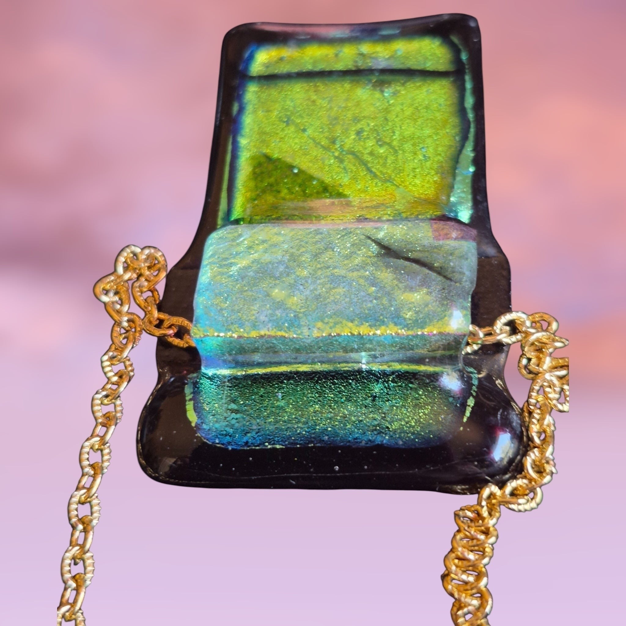 Heartfelt Creations handcrafted dichroic glass pendant necklace in vibrant green and black on a gold-tone chain.