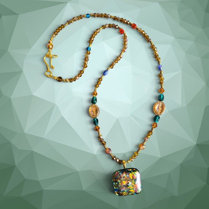 Heartfelt Creations artisan dichroic glass pendant necklace with amber crystals, teal beads, and metallic spacers.