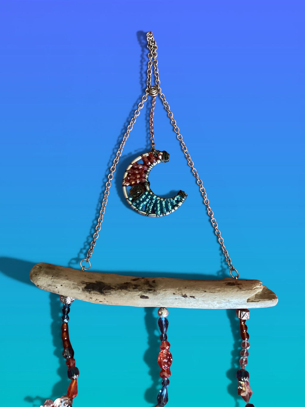 Heartfelt Creations exotic suncatcher with crescent moon, driftwood, turquoise, gold glass, crystal beads, and heart stone.