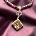 Heartfelt Creations druzy pendant necklace with diamond-shaped stone, silver-tone bezel, and pink/purple faceted beads.