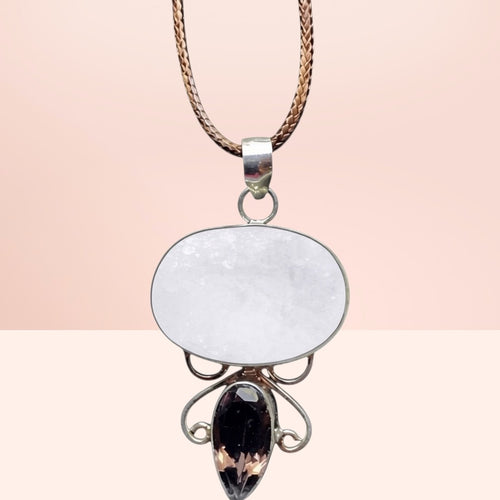 Heartfelt Creations artisan necklace with oval druzy and smoky quartz pendant on a braided cord with filigree details.