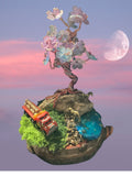 Heartfelt Creations miniature diorama with wire-wrapped tree, pastel blossoms, moss, blue water, and red logging truck.
