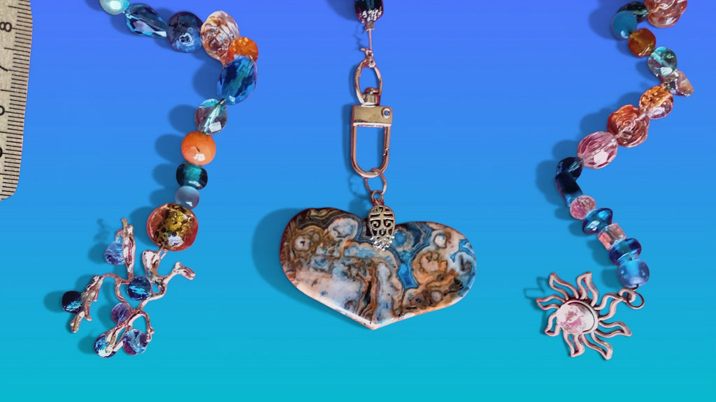 Heartfelt Creations exotic suncatcher with crystal, glass, and stone beads, featuring a heart-shaped stone.