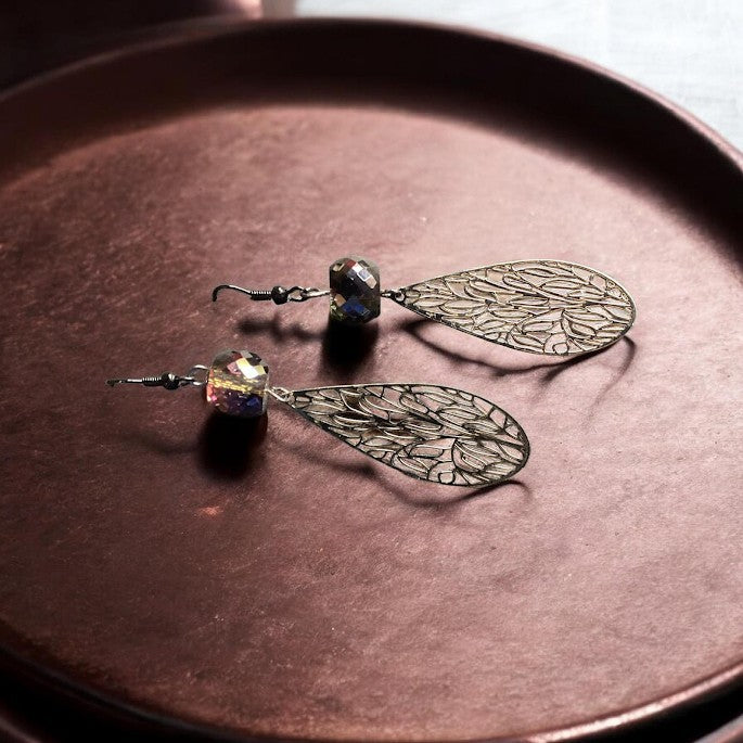 Heartfelt Creations teardrop dangle earrings with intricate silver filigree and iridescent faceted crystal beads.
