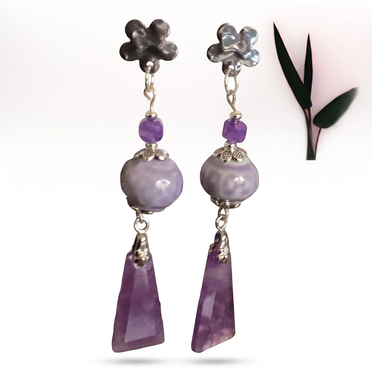 Heartfelt Creations floral dangle earrings featuring silver flower studs, lilac ceramic beads, and amethyst pendants.
