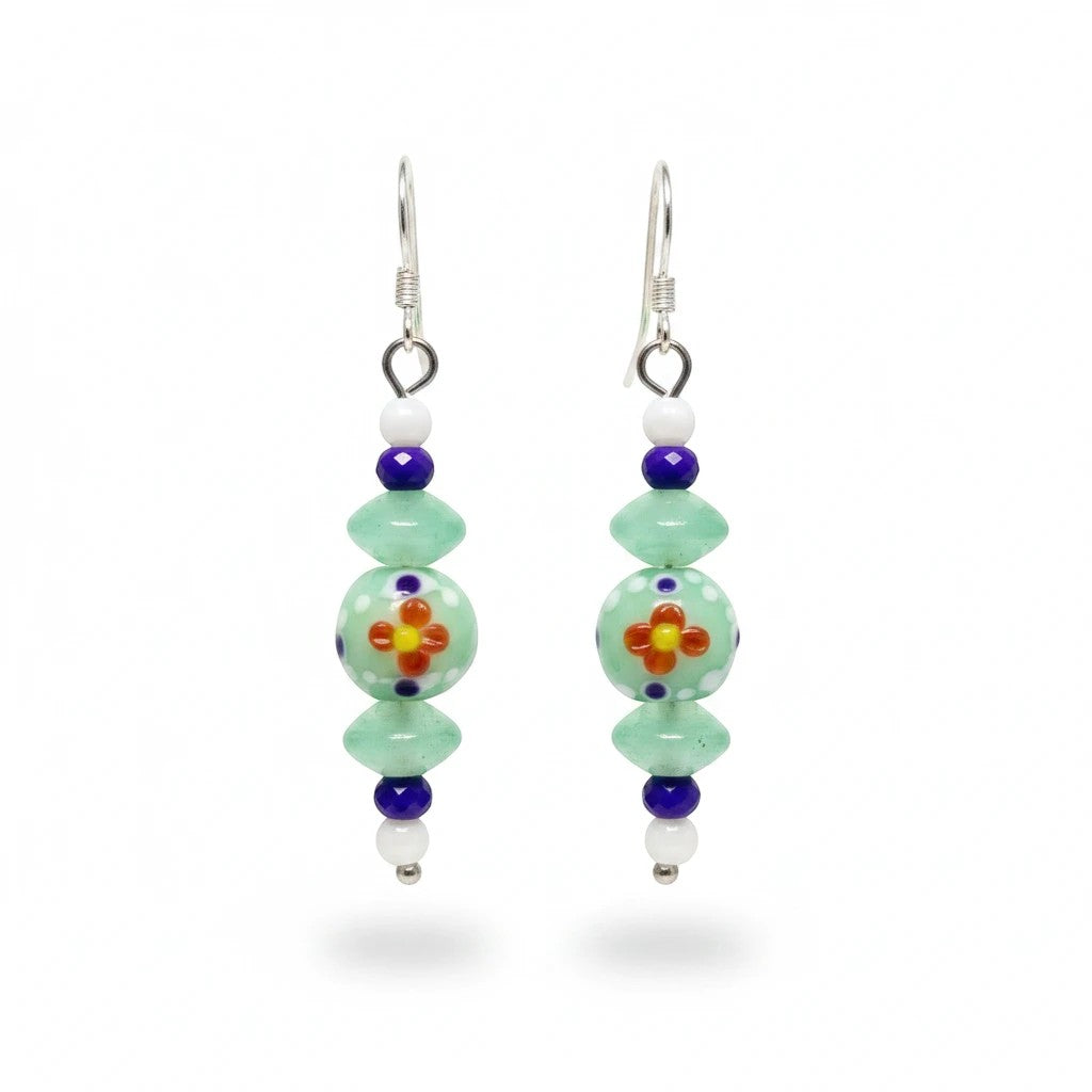 Heartfelt Creations handcrafted dangle earrings featuring mint green, purple, and white beads with floral motifs.
