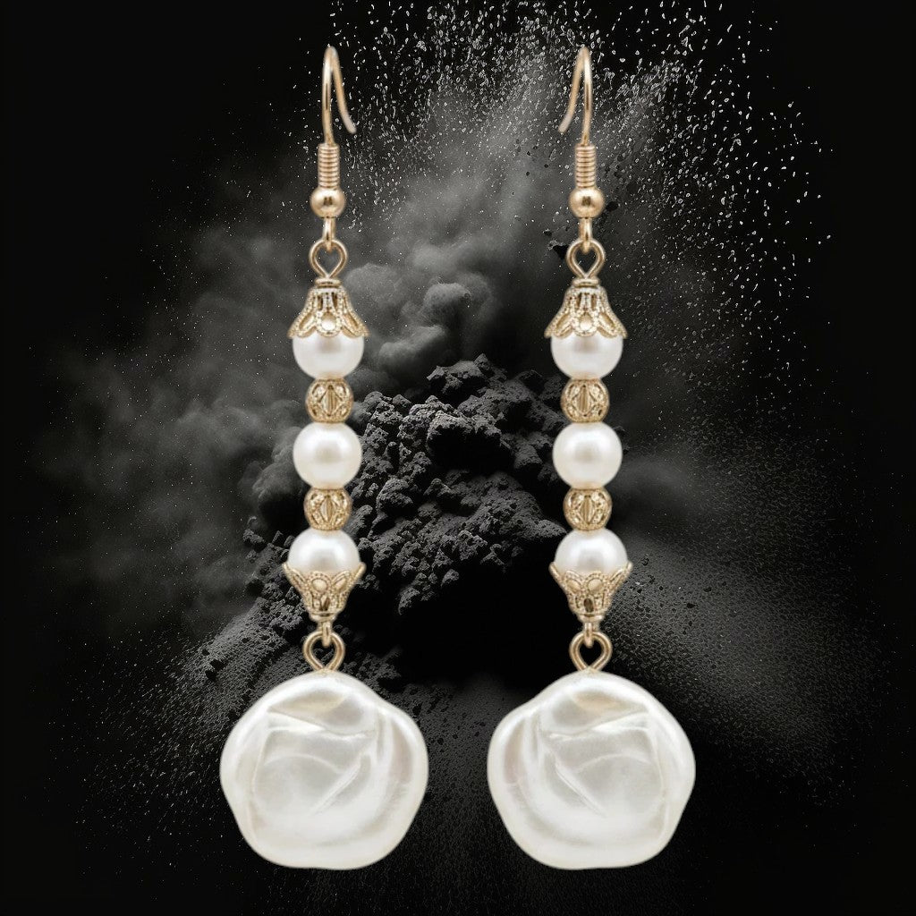 Heartfelt Creations elegant floral pearl drop earrings with vintage-inspired gold filigree caps on a black background