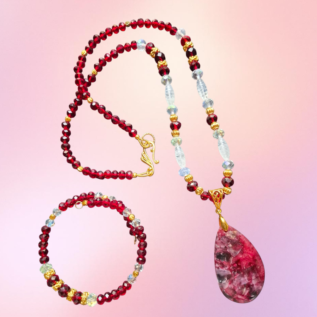 Heartfelt Creations elegant beaded necklace and bracelet set with crimson garnet beads, clear crystals, and gold-tone spacers. Teardrop pendant.