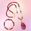 Heartfelt Creations elegant beaded necklace and bracelet set with crimson garnet beads, clear crystals, and gold-tone spacers. Teardrop pendant.