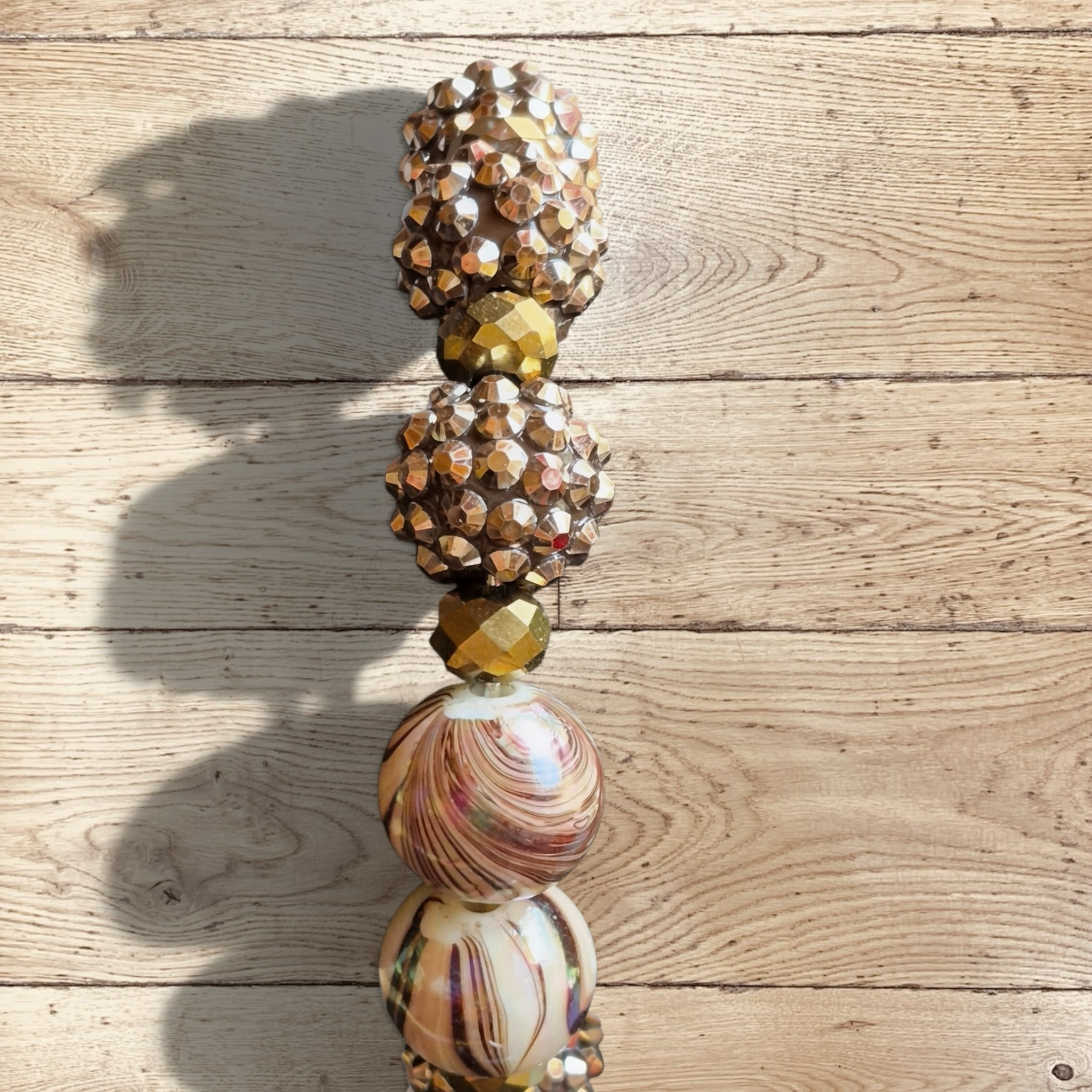 Heartfelt Creations handmade bracelet with marbled beads, gold-tone faceted beads, and champagne rondelles.