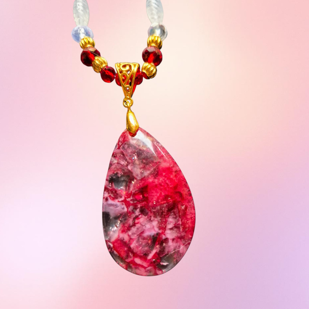Heartfelt Creations elegant teardrop pendant necklace with crimson garnet beads and gold accents.