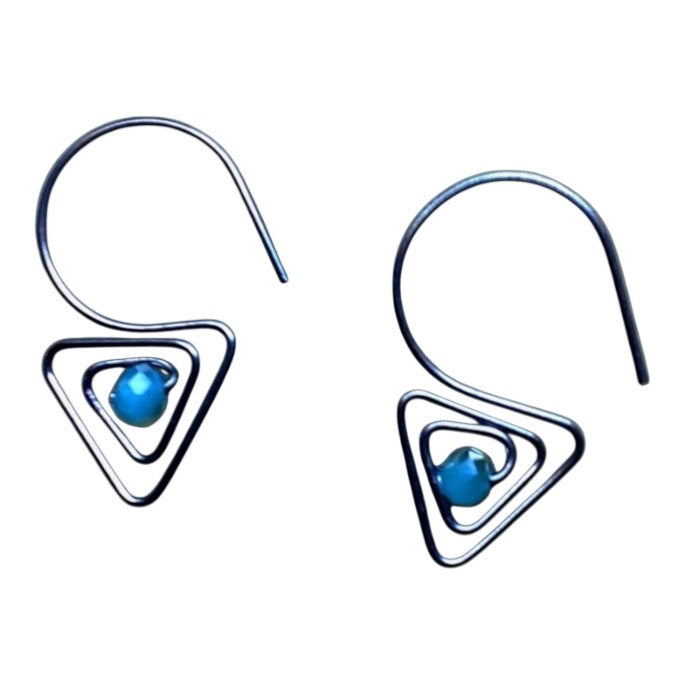 Heartfelt Creations handcrafted geometric wire-wrapped earrings featuring a dark metal triangle and turquoise bead.