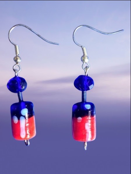 Heartfelt Creations handcrafted dangle earrings featuring royal blue and red glass cylinder beads on silver hooks.