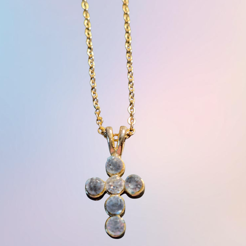 Heartfelt Creations gold cross pendant necklace with cubic zirconia stones and delicate chain.