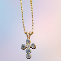 Heartfelt Creations gold cross pendant necklace with cubic zirconia stones and delicate chain.