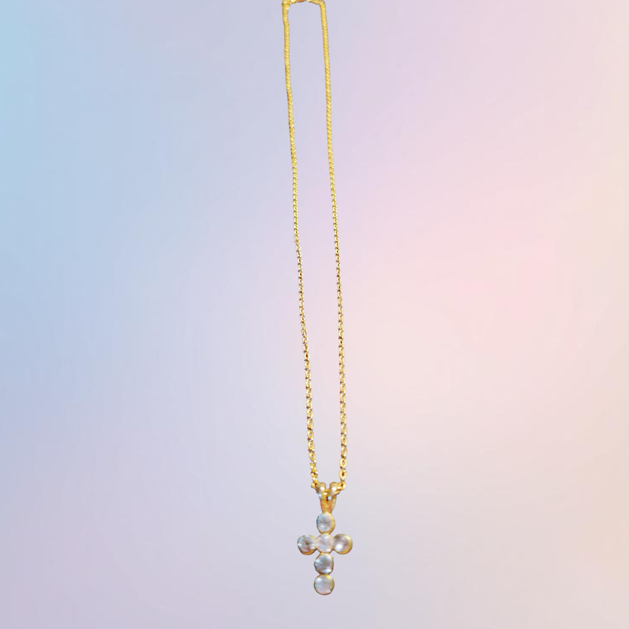 Heartfelt Creations gold cross pendant necklace with cubic zirconia stones and delicate chain.