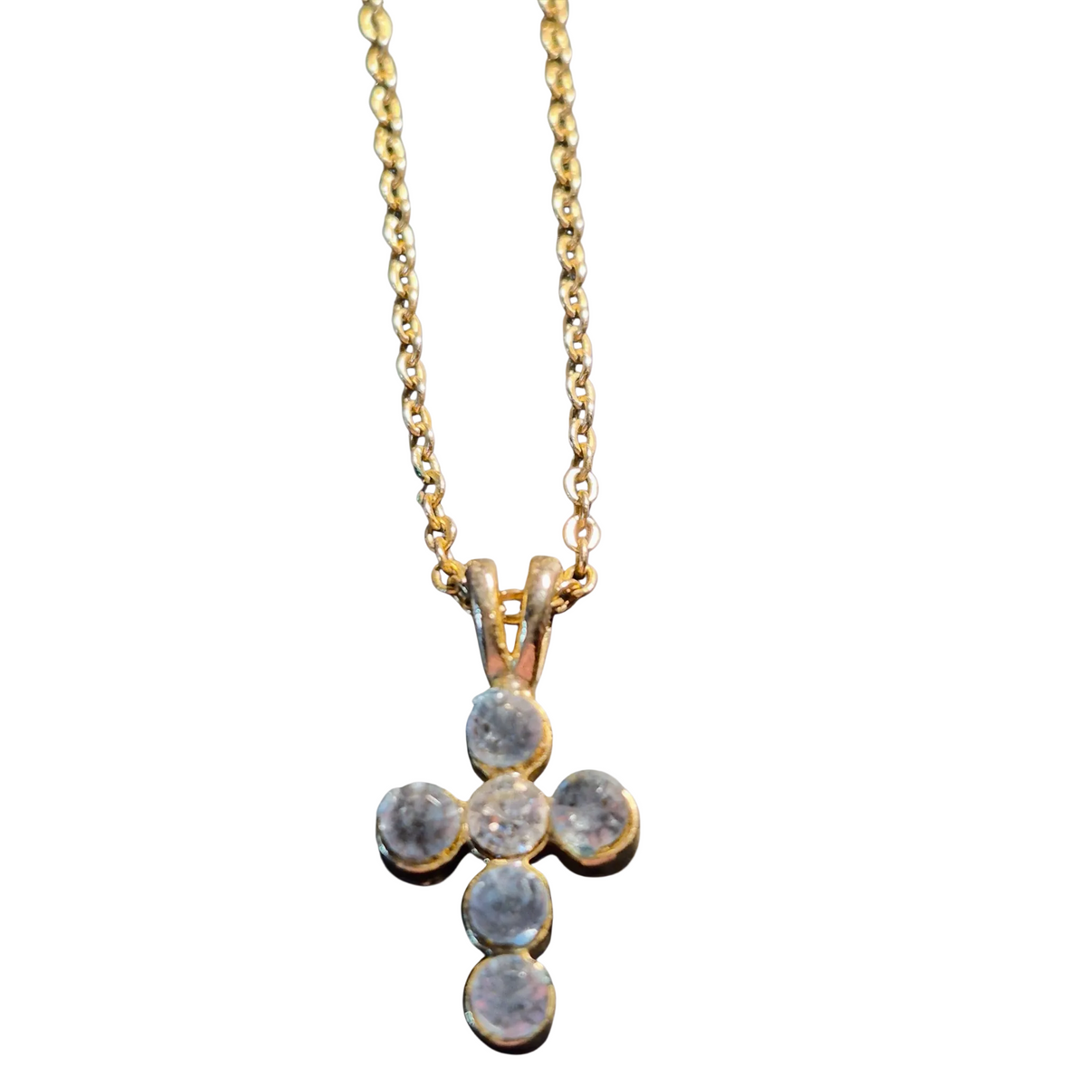 Heartfelt creations, dainty cross with a lovely blue grey cubic zirconium stones, hanging from a golden chain.