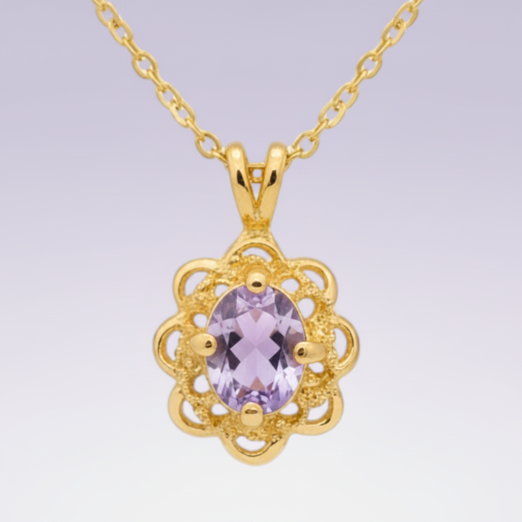 Heartfelt Creations gold-plated necklace with an intricate floral pendant and a central oval purple gemstone.