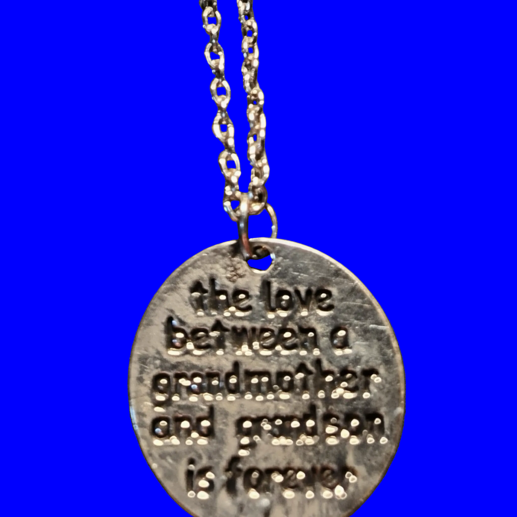 Heartfelt Creations silver-toned metal pendant necklace engraved with 'the love between a grandmother and grandson is forever'.