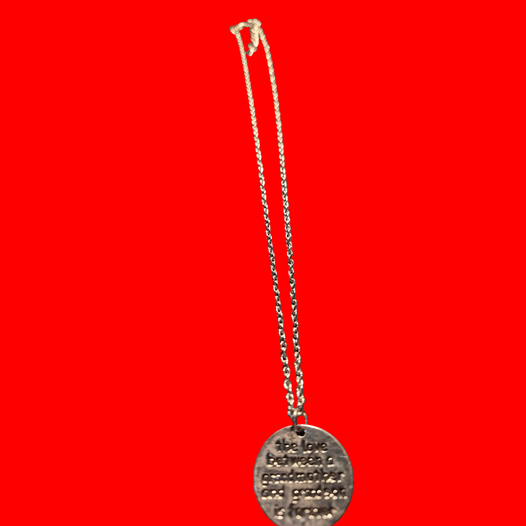 Heartfelt Creations silver-toned metal pendant necklace engraved with 'the love between a grandmother and grandson is forever'.
